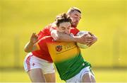 24 April 2022; Conor Crowley of Carlow is tackled by Niall Sharkey of Louth during the Leinster GAA Football Senior Championship Round 1 match between Louth and Carlow at Páirc Tailteann in Navan, Meath. Photo by Eóin Noonan/Sportsfile
