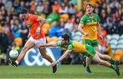 24 April 2022; Stefan Campbell of Armagh in action against Ryan McHugh of Donegal  during the Ulster GAA Football Senior Championship Quarter-Final match between Donegal and Armagh at Páirc MacCumhaill in Ballybofey, Donegal. Photo by Ramsey Cardy/Sportsfile