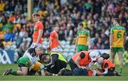 24 April 2022; Greg McCabe of Armagh and Ryan McHugh of Donegal are treated for injuries after a collision during the Ulster GAA Football Senior Championship Quarter-Final match between Donegal and Armagh at Páirc MacCumhaill in Ballybofey, Donegal. Photo by Ramsey Cardy/Sportsfile