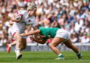 24 April 2022; Neve Jones of Ireland tackles Marlie Packer of England during the TikTok Women's Six Nations Rugby Championship match between England and Ireland at Mattioli Woods Welford Road Stadium in Leicester, England. Photo by Darren Staples/Sportsfile