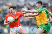24 April 2022; Ben Crealey of Armagh in action against Jamie Brennan of Donegal during the Ulster GAA Football Senior Championship Quarter-Final match between Donegal and Armagh at Páirc MacCumhaill in Ballybofey, Donegal. Photo by Ramsey Cardy/Sportsfile
