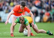 24 April 2022; Stephen McMenamin of Donegal in action against Jarly Óg Burns of Armagh during the Ulster GAA Football Senior Championship Quarter-Final match between Donegal and Armagh at Páirc MacCumhaill in Ballybofey, Donegal. Photo by Ramsey Cardy/Sportsfile