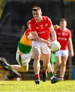 24 April 2022; Dan Corcoran of Louth is tackled by Conor Doyle of Carlow during the Leinster GAA Football Senior Championship Round 1 match between Louth and Carlow at Páirc Tailteann in Navan, Meath. Photo by Eóin Noonan/Sportsfile