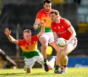 24 April 2022; Dan Corcoran of Louth is tackled by Conor Doyle of Carlow during the Leinster GAA Football Senior Championship Round 1 match between Louth and Carlow at Páirc Tailteann in Navan, Meath. Photo by Eóin Noonan/Sportsfile