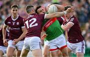 24 April 2022; Jason Doherty of Mayo is tackled by Johnny Heaney of Galway during the Connacht GAA Football Senior Championship Quarter-Final match between Mayo and Galway at Hastings Insurance MacHale Park in Castlebar, Mayo. Photo by Brendan Moran/Sportsfile