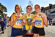 24 April 2022; The UCD AC team, from left, Kate Nurse, Ellie Hartnett and Sarah Healy, celebrate with the cup after winning the senior women's race during the Irish Life Health AAI Road Relays in Raheny, Dublin. Photo by Sam Barnes/Sportsfile