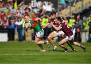 24 April 2022; Ryan O’Donoghue of Mayo in action against Paul Conroy  and Liam Silke of Galway during the Connacht GAA Football Senior Championship Quarter-Final match between Mayo and Galway at Hastings Insurance MacHale Park in Castlebar, Mayo. Photo by Ray Ryan/Sportsfile