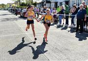 24 April 2022; Danielle Donegan, left, and Fiona Mckenna, both of UCD AC, Dublin, competing in the senior womens race during Irish Life Health AAI Road Relays in Raheny, Dublin. Photo by Sam Barnes/Sportsfile
