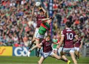 24 April 2022; Sean Kelly of Galway fields the ball against Conor Loftus of Mayo  during the Connacht GAA Football Senior Championship Quarter-Final match between Mayo and Galway at Hastings Insurance MacHale Park in Castlebar, Mayo. Photo by Ray Ryan/Sportsfile