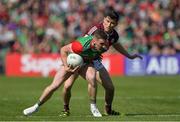 24 April 2022; Eoghan McLaughlin of Mayo in action against Finnian O Lari of Galway during the Connacht GAA Football Senior Championship Quarter-Final match between Mayo and Galway at Hastings Insurance MacHale Park in Castlebar, Mayo. Photo by Ray Ryan/Sportsfile