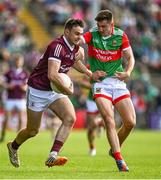 24 April 2022; Cillian McDaid of Galway is tackled by Enda Hession of Mayo during the Connacht GAA Football Senior Championship Quarter-Final match between Mayo and Galway at Hastings Insurance MacHale Park in Castlebar, Mayo. Photo by Brendan Moran/Sportsfile