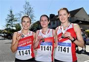 24 April 2022; The Sportsworlds AC, Dublin, team, from left, Maria Jones, Noreen Brouder and Aoife O'Leary with their gold medals after winning the over 35 women's race during the Irish Life Health AAI Road Relays in Raheny, Dublin. Photo by Sam Barnes/Sportsfile