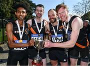 24 April 2022; The Clonliffe Harriers AC, Dublin, team, from left, Efrem Gidey, Ian Guiden, Mark McDonald and Sean O'Leary, celebrate with the cup after winning the senior men's race during the Irish Life Health AAI Road Relays in Raheny, Dublin. Photo by Sam Barnes/Sportsfile