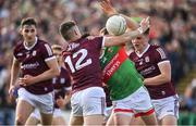 24 April 2022; Jason Doherty of Mayo is dispossessed by Johnny Heaney during the Connacht GAA Football Senior Championship Quarter-Final match between Mayo and Galway at Hastings Insurance MacHale Park in Castlebar, Mayo. Photo by Brendan Moran/Sportsfile