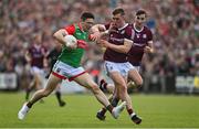 24 April 2022; Conor Loftus of Mayo is tackled by Jack Glynn of Galway during the Connacht GAA Football Senior Championship Quarter-Final match between Mayo and Galway at Hastings Insurance MacHale Park in Castlebar, Mayo. Photo by Brendan Moran/Sportsfile