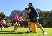 25 April 2022; Michael Milne and contact skills coach Denis Leamy during a Leinster rugby squad training session at Westerford High School in Cape Town, South Africa. Photo by Harry Murphy/Sportsfile