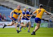 24 April 2022; Paul Flanagan of Clare passes to David McInerney during the Munster GAA Hurling Senior Championship Round 2 match between Tipperary and Clare at FBD Semple Stadium in Thurles, Tipperary. Photo by Ray McManus/Sportsfile