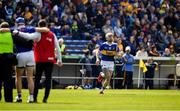 24 April 2022; John McGrath of Tipperary is assisted off the field as his substitute Ger Browne makes his way onto the pitch during the Munster GAA Hurling Senior Championship Round 2 match between Tipperary and Clare at FBD Semple Stadium in Thurles, Tipperary. Photo by Ray McManus/Sportsfile