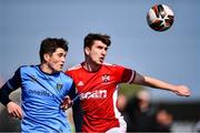 26 April 2022; Michael Glynn of Queen's University Belfast in action against Colm Whelan of UCD during the Collingwood Cup Final match between UCD and Queens University Belfast at Oriel Park in Dundalk, Louth. Photo by Ben McShane/Sportsfile