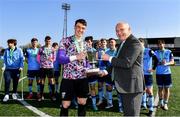 26 April 2022; FAI president Gerry McAnaney presents the Collingwood Cup to UCD captain and goalkeeper Lorcan Healy after the Collingwood Cup Final match between UCD and Queens University Belfast at Oriel Park in Dundalk, Louth. Photo by Ben McShane/Sportsfile