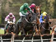 26 April 2022; Felix Dejsy, with Jack Kennedy up, second from right, clears the last alongside eventual second Tax For Max, with Daryl Jacob up, on their way to winning the Killashee Hotel Handicap Hurdle during day one of the Punchestown Festival at Punchestown Racecourse in Kildare. Photo by David Fitzgerald/Sportsfile