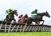 26 April 2022; Felix Dejsy, with Jack Kennedy up, centre, clears the last behind eventual second Tax For Max, with Daryl Jacob up, right, and eventual fifth Great Bear, with Darragh O'Keeffe up, left, on their way to winning the Killashee Hotel Handicap Hurdle during day one of the Punchestown Festival at Punchestown Racecourse in Kildare. Photo by David Fitzgerald/Sportsfile