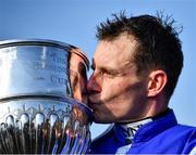 26 April 2022; Jockey Paul Townend celebrates with the Blessington Cup after winning the William Hill Champion Steeplechase on Energumene during day one of the Punchestown Festival at Punchestown Racecourse in Kildare. Photo by David Fitzgerald/Sportsfile