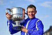 26 April 2022; Jockey Paul Townend celebrates with the Blessington Cup after winning the William Hill Champion Steeplechase on Energumene during day one of the Punchestown Festival at Punchestown Racecourse in Kildare. Photo by David Fitzgerald/Sportsfile