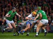 23 April 2022; Jack Prendergast of Waterford is tackled by Limerick players Declan Hannon, left, Diarmaid Byrnes and Dan Morrisey, 7,  during the Munster GAA Hurling Senior Championship Round 2 match between Limerick and Waterford at TUS Gaelic Grounds in Limerick. Photo by Ray McManus/Sportsfile