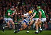 23 April 2022; Jack Prendergast of Waterford is tackled by Limerick players Declan Hannon, Diarmaid Byrnes and Dan Morrisey during the Munster GAA Hurling Senior Championship Round 2 match between Limerick and Waterford at TUS Gaelic Grounds in Limerick. Photo by Ray McManus/Sportsfile