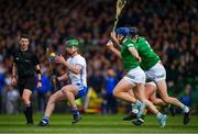 23 April 2022; Michael Kiely of Waterford is tackled by Limerick players Mike Casey, William O'Donoghue and Darragh O'Donovan during the Munster GAA Hurling Senior Championship Round 2 match between Limerick and Waterford at TUS Gaelic Grounds in Limerick. Photo by Ray McManus/Sportsfile