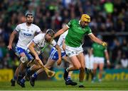 23 April 2022; Cathal O'Neill of Limerick is tackled by Jamie Barron of Waterford during the Munster GAA Hurling Senior Championship Round 2 match between Limerick and Waterford at TUS Gaelic Grounds in Limerick. Photo by Ray McManus/Sportsfile