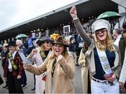 27 April 2022; Bride to be Chloe Hitchen, right, and fellow Hen do member Laura Johnson, centre, both from Cheshire in England, celebrate a winner in the Connolly's RED MILLS Irish EBF Auction Hurdle Series Final during day two of the Punchestown Festival at Punchestown Racecourse in Kildare. Photo by David Fitzgerald/Sportsfile