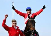 27 April 2022; Paul Townend celebrates on Allaho alongside groom Paul Roche after they won the Ladbrokes Punchestown Gold Cup during day two of the Punchestown Festival at Punchestown Racecourse in Kildare. Photo by David Fitzgerald/Sportsfile
