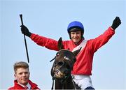 27 April 2022; Paul Townend celebrates on Allaho alongside groom Paul Roche after they won the Ladbrokes Punchestown Gold Cup during day two of the Punchestown Festival at Punchestown Racecourse in Kildare. Photo by David Fitzgerald/Sportsfile