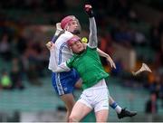 27 April 2022; Shane O'Brien of Limerick in action against Josh Fitzgerald of Waterford during the oneills.com Munster GAA Hurling U20 Championship Semi-Final match between Limerick and Waterford at TUS Gaelic Grounds in Limerick, Ireland. Photo by Michael P Ryan/Sportsfile