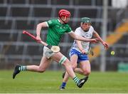 27 April 2022; Donnacha O'Dalaigh of Limerick in action against Joe Booth of Waterford during the oneills.com Munster GAA Hurling U20 Championship Semi-Final match between Limerick and Waterford at TUS Gaelic Grounds in Limerick, Ireland. Photo by Michael P Ryan/Sportsfile