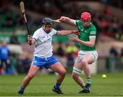 27 April 2022; Donnacha O'Dalaigh of Limerick in action against Colin Foley of Waterford during the oneills.com Munster GAA Hurling U20 Championship Semi-Final match between Limerick and Waterford at TUS Gaelic Grounds in Limerick, Ireland. Photo by Michael P Ryan/Sportsfile