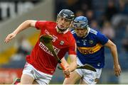27 April 2022; Jack Cahalane of Cork in action against Conor Cadell of Tipperary during the oneills.com Munster GAA Hurling U20 Championship semi-final match between Tipperary and Cork at FBD Semple Stadium in Thurles, Tipperary. Photo by Diarmuid Greene/Sportsfile