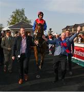 27 April 2022; Owners Ger O'Brien, left, and Sean Deane celebrate as they lead in jockey Patrick Mullins and Facile Vega after winning the Race & Stay At Punchestown Champion INH Flat Race during day two of the Punchestown Festival at Punchestown Racecourse in Kildare. Photo by Seb Daly/Sportsfile