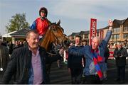27 April 2022; Owners Ger O'Brien, left, and Sean Deane celebrate as they lead in jockey Patrick Mullins and Facile Vega after winning the Race & Stay At Punchestown Champion INH Flat Race during day two of the Punchestown Festival at Punchestown Racecourse in Kildare. Photo by Seb Daly/Sportsfile