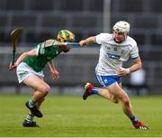 27 April 2022; Padraig Fitzgerald of Waterford in action against Evan O'Leary of Limerick during the oneills.com Munster GAA Hurling U20 Championship Semi-Final match between Limerick and Waterford at TUS Gaelic Grounds in Limerick, Ireland. Photo by Michael P Ryan/Sportsfile