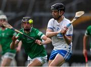 27 April 2022; Cian Rellis of Waterford in action against Barry Duff of Limerick during the oneills.com Munster GAA Hurling U20 Championship Semi-Final match between Limerick and Waterford at TUS Gaelic Grounds in Limerick, Ireland. Photo by Michael P Ryan/Sportsfile