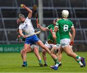 27 April 2022; Joe Booth of Waterford in action against Aidan O'Connor of Limerick during the oneills.com Munster GAA Hurling U20 Championship Semi-Final match between Limerick and Waterford at TUS Gaelic Grounds in Limerick, Ireland. Photo by Michael P Ryan/Sportsfile