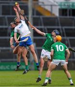 27 April 2022; Joe Booth of Waterford in action against Aidan O'Connor of Limerick during the oneills.com Munster GAA Hurling U20 Championship Semi-Final match between Limerick and Waterford at TUS Gaelic Grounds in Limerick, Ireland. Photo by Michael P Ryan/Sportsfile