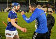 27 April 2022; Tipperary manager Brendan Cummins celebrates with Sean Kenneally of Tipperary after the oneills.com Munster GAA Hurling U20 Championship semi-final match between Tipperary and Cork at FBD Semple Stadium in Thurles, Tipperary. Photo by Diarmuid Greene/Sportsfile