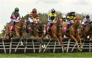 28 April 2022; Runners and riders, from left, Mount Brown, with Eoin Walsh up, Luke Short, with Sean Flanagan up, The Greek, with Jack Kennedy up, and Powersbomb, with Phillip Enright up, jump the first during the Specialist Joinery Group Handicap Hurdle on day three of the Punchestown Festival at Punchestown Racecourse in Kildare. Photo by Seb Daly/Sportsfile