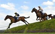 28 April 2022; Ballyboker Bridge, left, with Tiernan Power Roche up, jumps Ruby's Double on their way to winning the Mongey Communications La Touche Cup Cross Country Steeplechase, alongside Call It Magic, right, with Keith Donoghue up, during day three of the Punchestown Festival at Punchestown Racecourse in Kildare. Photo by Seb Daly/Sportsfile