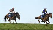 28 April 2022; Potters Corner, left, with Jack Tudor up, and Three Loud Knocks, with JJ Slevin up, jump Ruby's Double during the Mongey Communications La Touche Cup Cross Country Steeplechase on day three of the Punchestown Festival at Punchestown Racecourse in Kildare. Photo by Seb Daly/Sportsfile