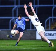 28 April 2022; Luke Breathnach of Dublin kicks for a point despite the attention of James McGrath of Kildare during the EirGrid Leinster GAA Football U20 Championship Final match between Dublin and Kildare at MW Hire O'Moore Park in Portlaoise, Laois. Photo by Ben McShane/Sportsfile